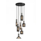 Seven cement mesh pendant lights clustered in an open space