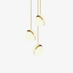 On an off-white backdrop, three of this Clérachic pendant hang in a cascading row.