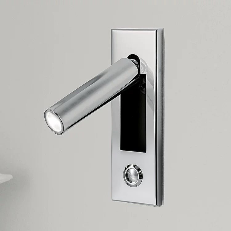 Close detail of the folding arm on a recessed bedside wall sconce