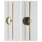 Two Clérachic wall sconce finishes compared side by side on grey: pale alabaster and dark marbled stone discs.
