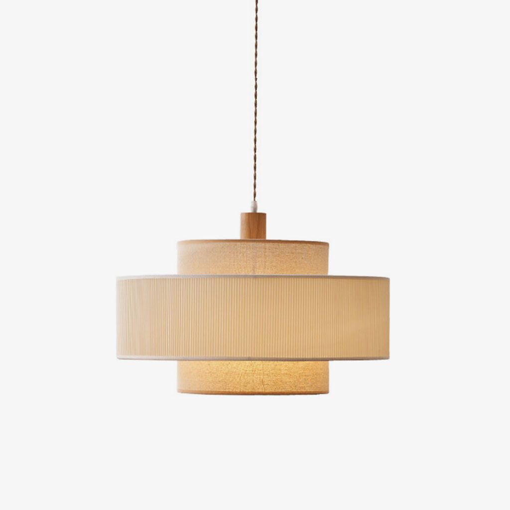 Product view of this Clérachic pendant, showing the wood neck cap atop its stacked pleated band and drum.