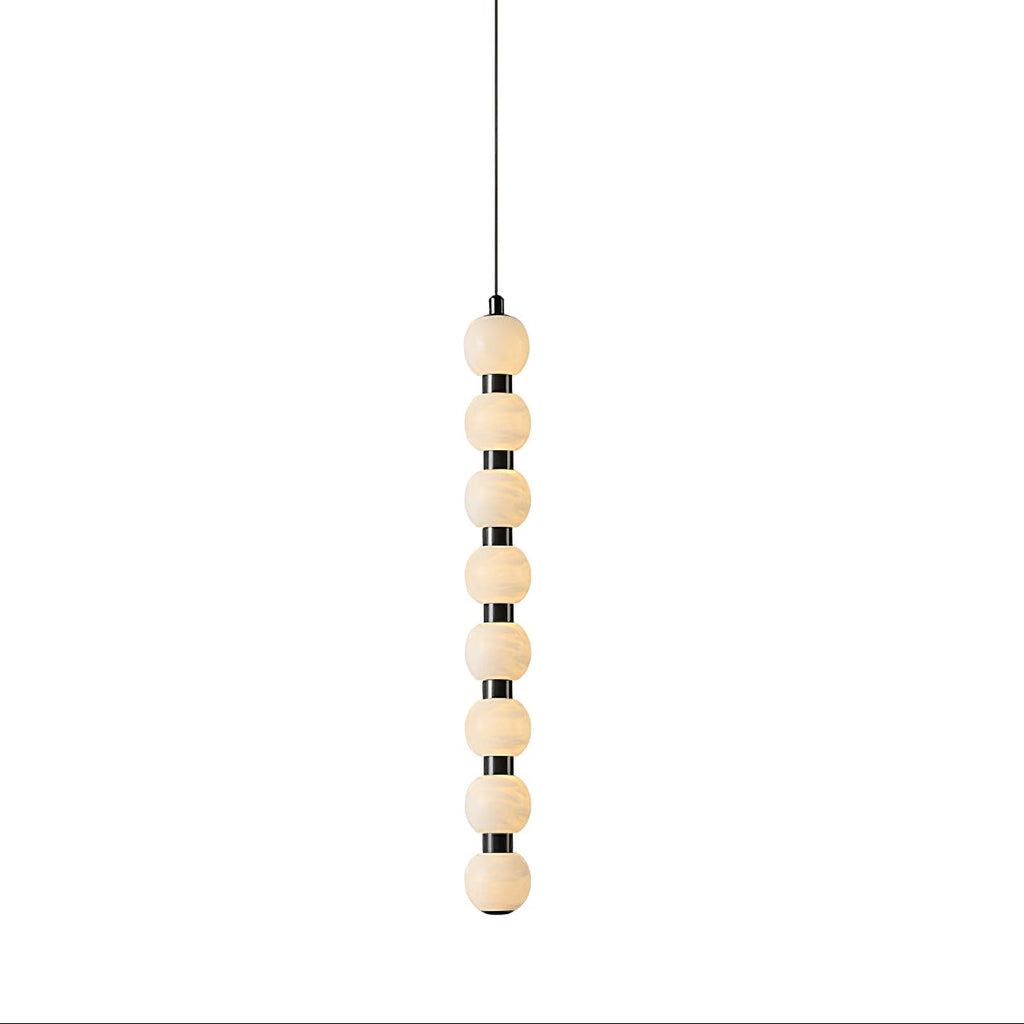 Eight-ball version of the Orbique pendant, alabaster spheres stacked along a black metal stem