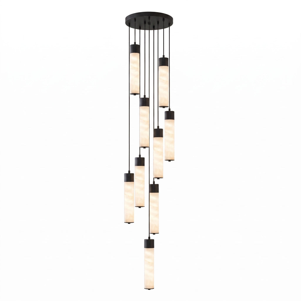 A dense cluster of black-capped alabaster tubes cascades from this Clérachic pendant's round ceiling plate on white.