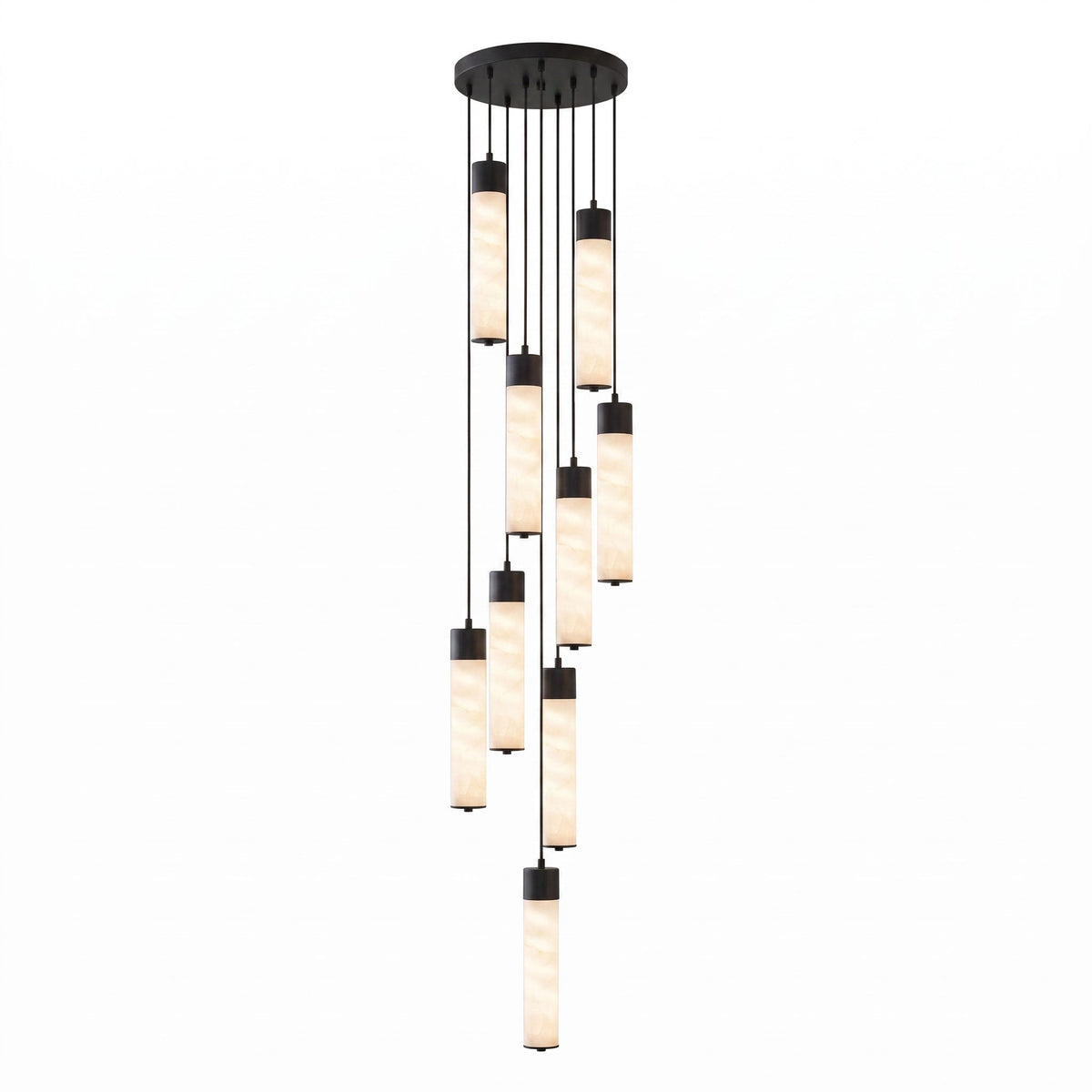 A dense cluster of black-capped alabaster tubes cascades from this Clérachic pendant's round ceiling plate on white.