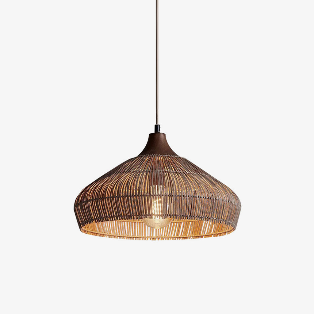 Product view of this Clérachic pendant, its dark tapered cap and bulging rattan dome shown against a plain background.