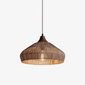 Product view of this Clérachic pendant, its dark tapered cap and bulging rattan dome shown against a plain background.