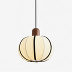 Product view of this Clérachic pendant's ribbed fabric shade with black seam trim, topped by a turned wood cap.