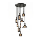 Nine cement mesh pendant lights hung together as a statement cluster