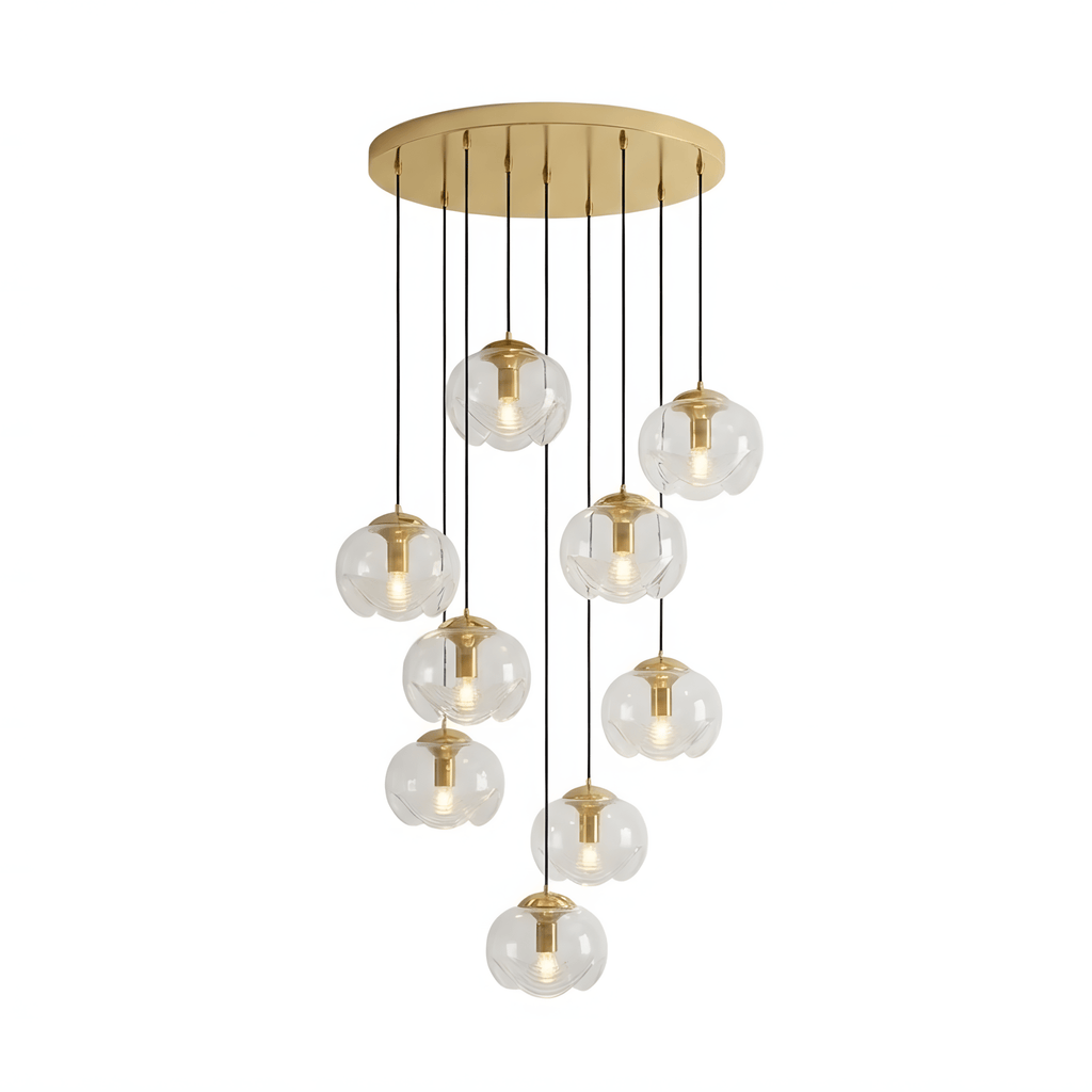 A tiered cascade of clear glass shades drops from a gold ceiling plate, this Clérachic fixture shown in a dense cluster.