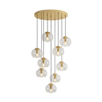 A tiered cascade of clear glass shades drops from a gold ceiling plate, this Clérachic fixture shown in a dense cluster.