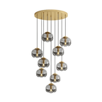 A dense cluster of smoky grey glass shades drops from a gold ceiling plate, this Clérachic fixture shown on a white background.