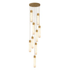 A denser cluster of brass-capped alabaster tubes hangs from this Clérachic pendant's round plate against white.