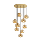 Amber glass shades spiral down from a gold ceiling plate in a dense cluster, this Clérachic fixture shown on a white background.