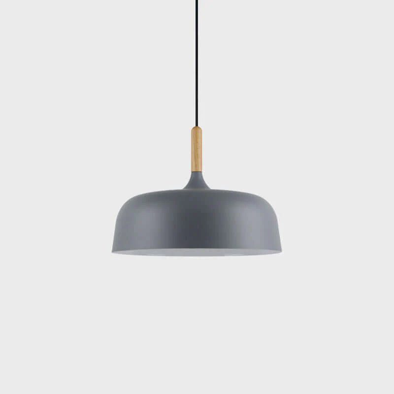 Acorn pendant light glowing softly in a warm interior
