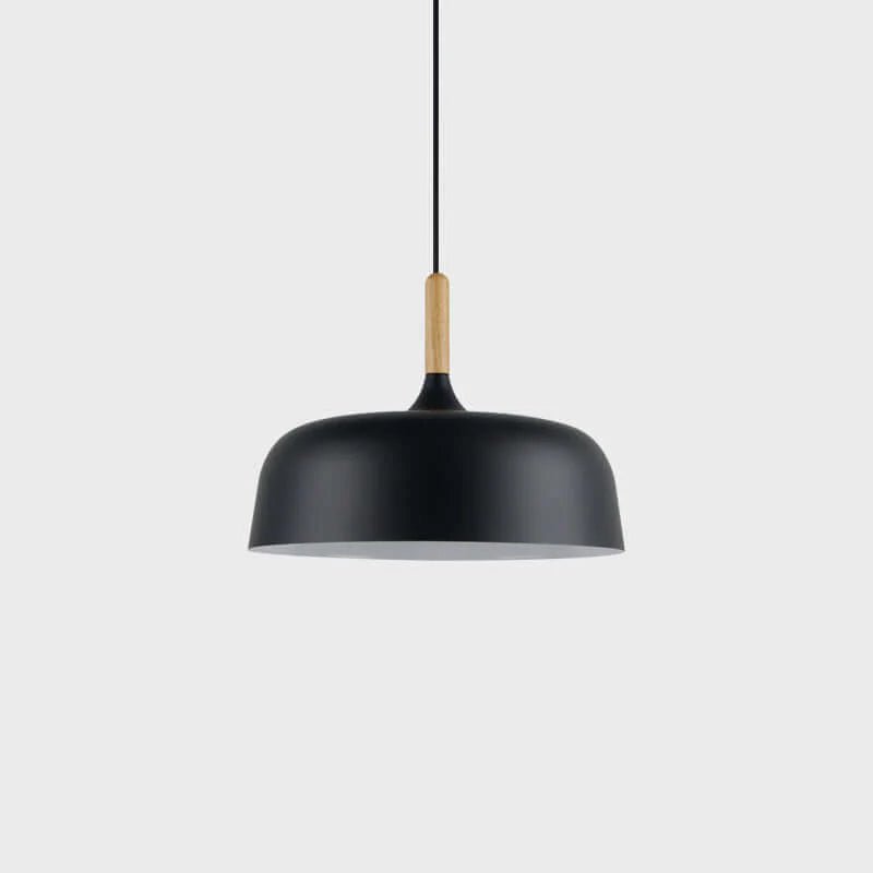 Acorn pendant light hanging above a styled dining table