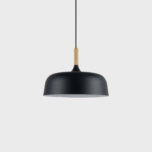 Acorn pendant light hanging above a styled dining table