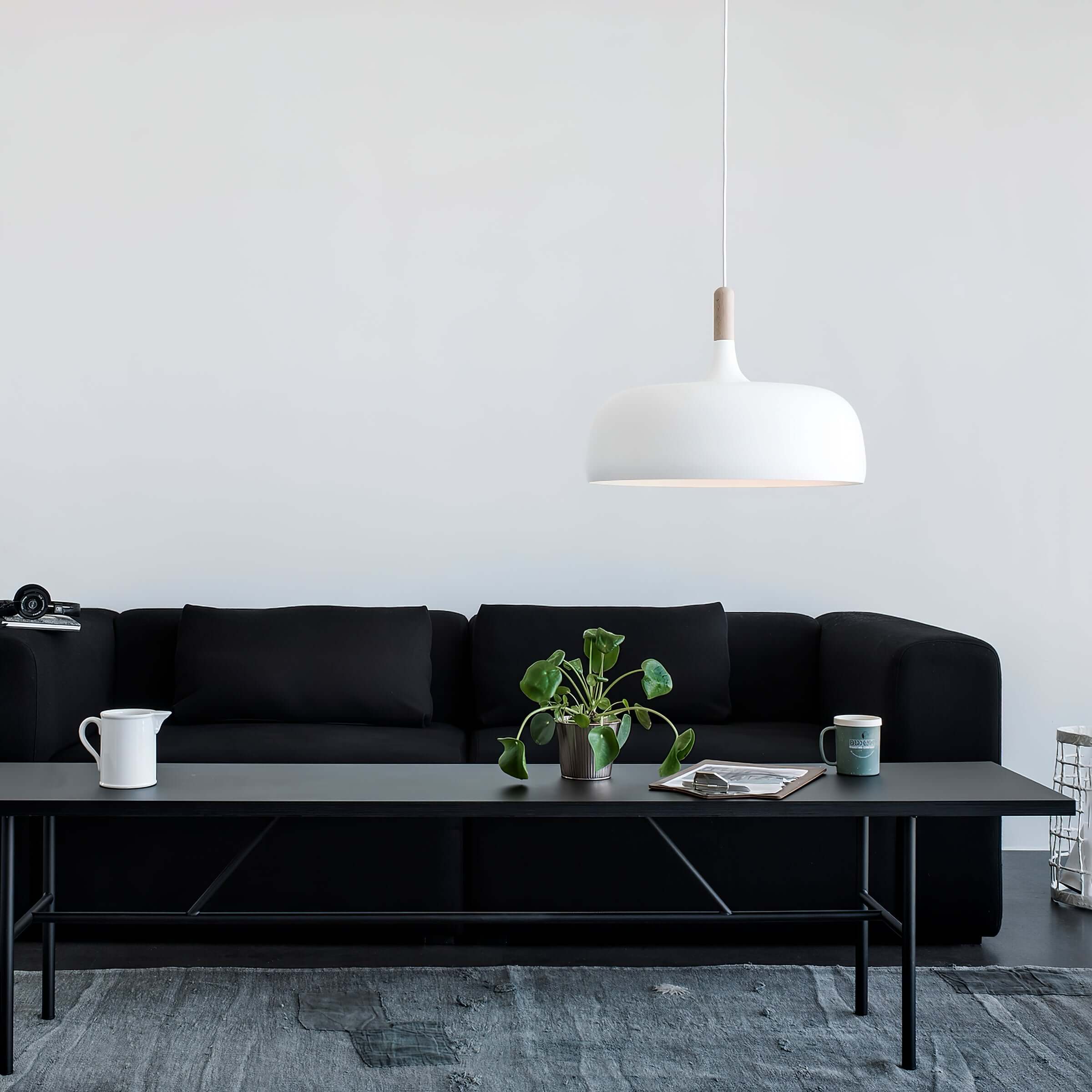 Acorn pendant light shown in a contemporary dining scene