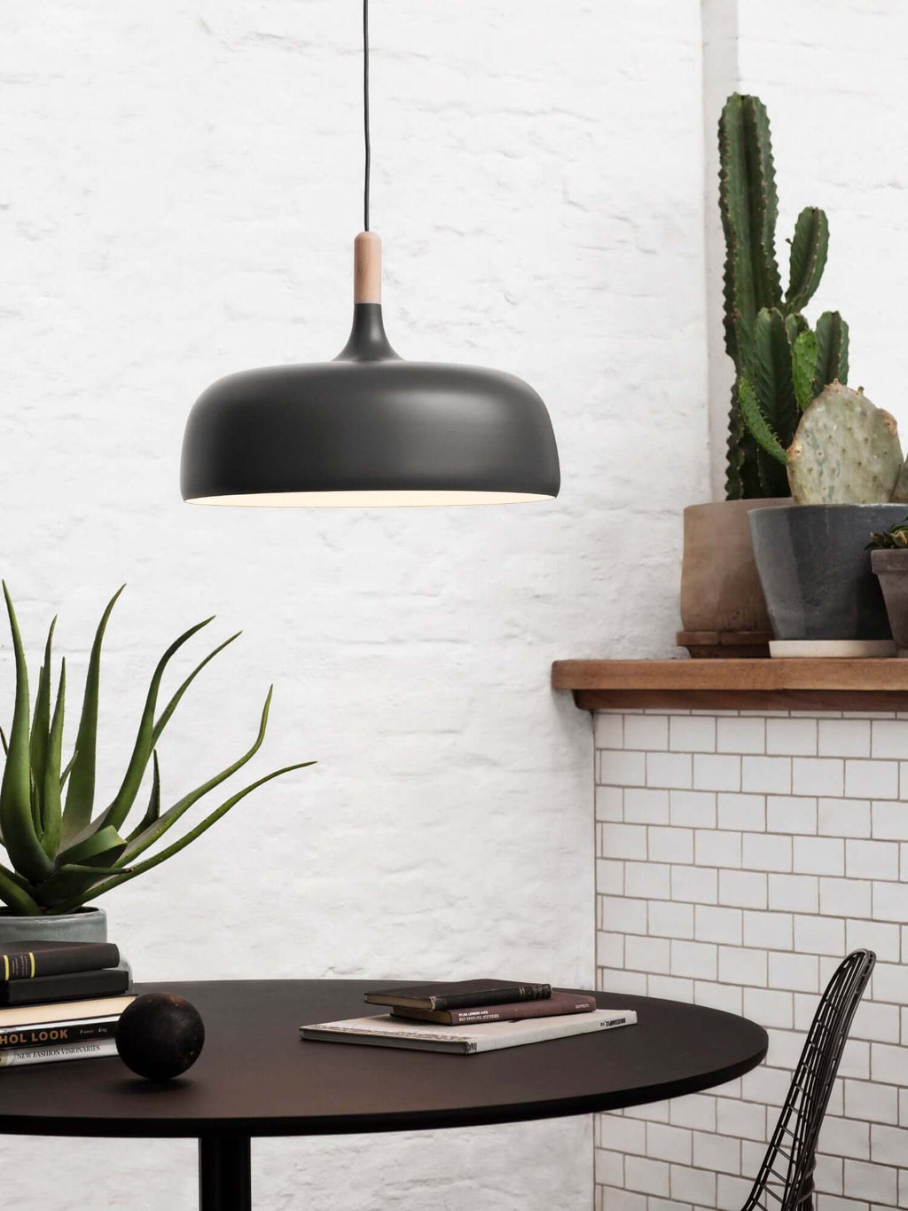 Acorn pendant light hanging in a minimalist interior