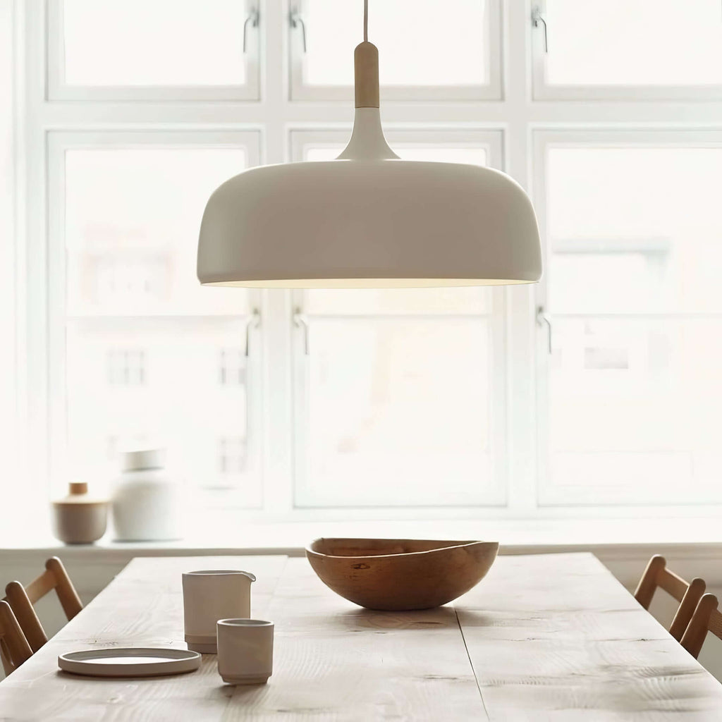 Acorn pendant light glowing in a softly lit room