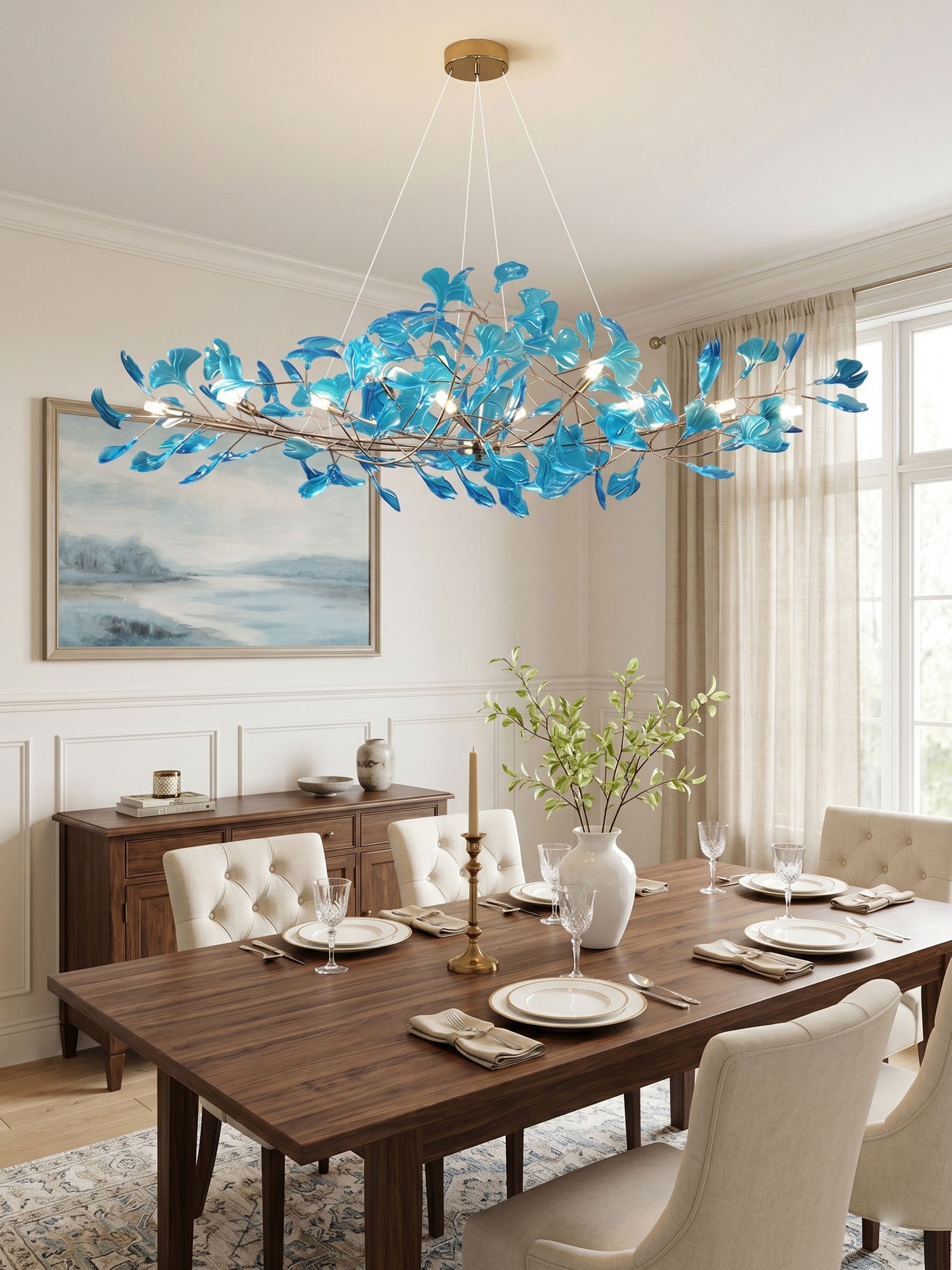 Ginkgo leaf chandelier with gold frame over a kitchen island