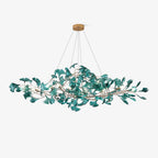 Ginkgo leaf chandelier suspended over a long rectangular table