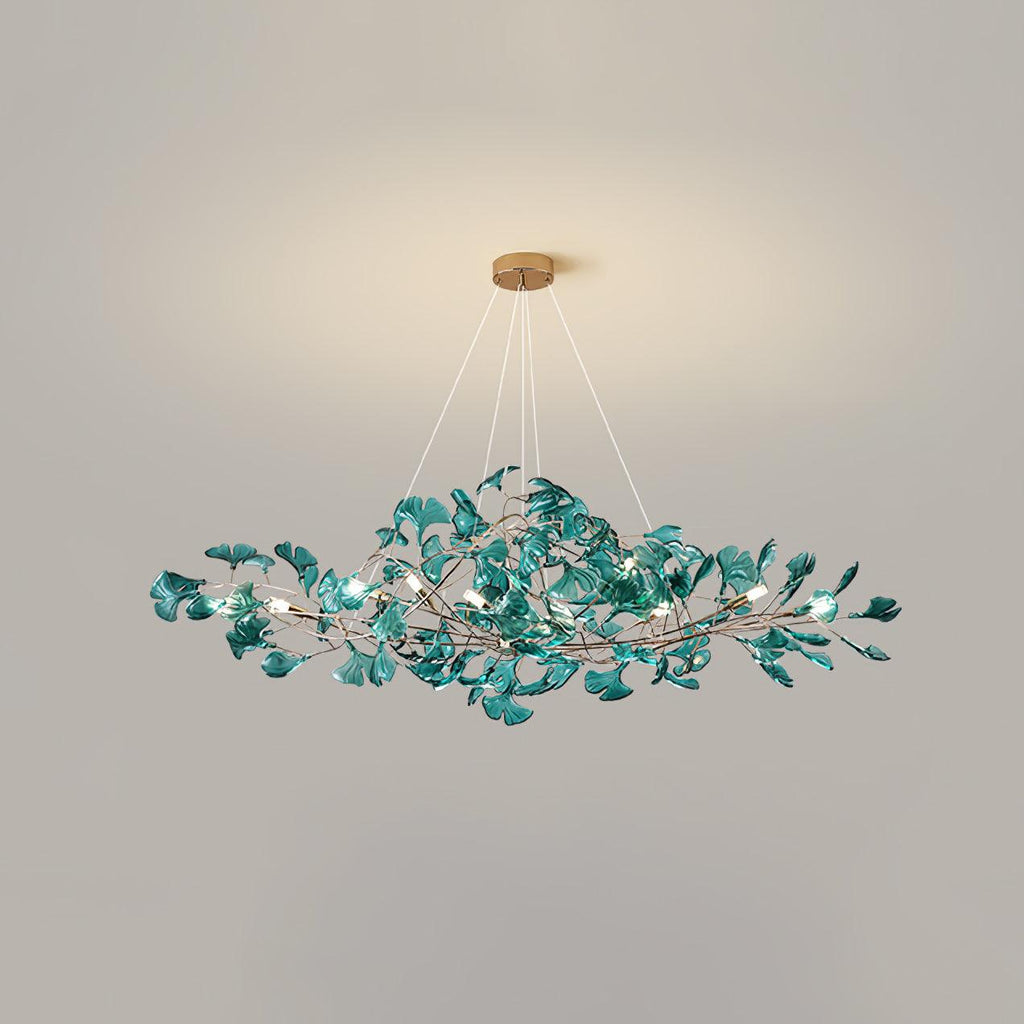 Ginkgo leaf chandelier shown lit in an evening dining scene