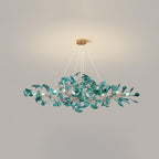 Ginkgo leaf chandelier shown lit in an evening dining scene