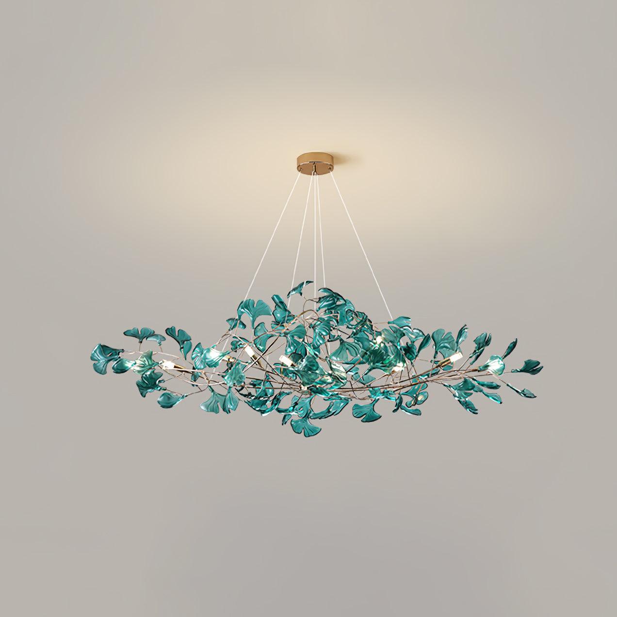 Ginkgo leaf chandelier shown lit in an evening dining scene