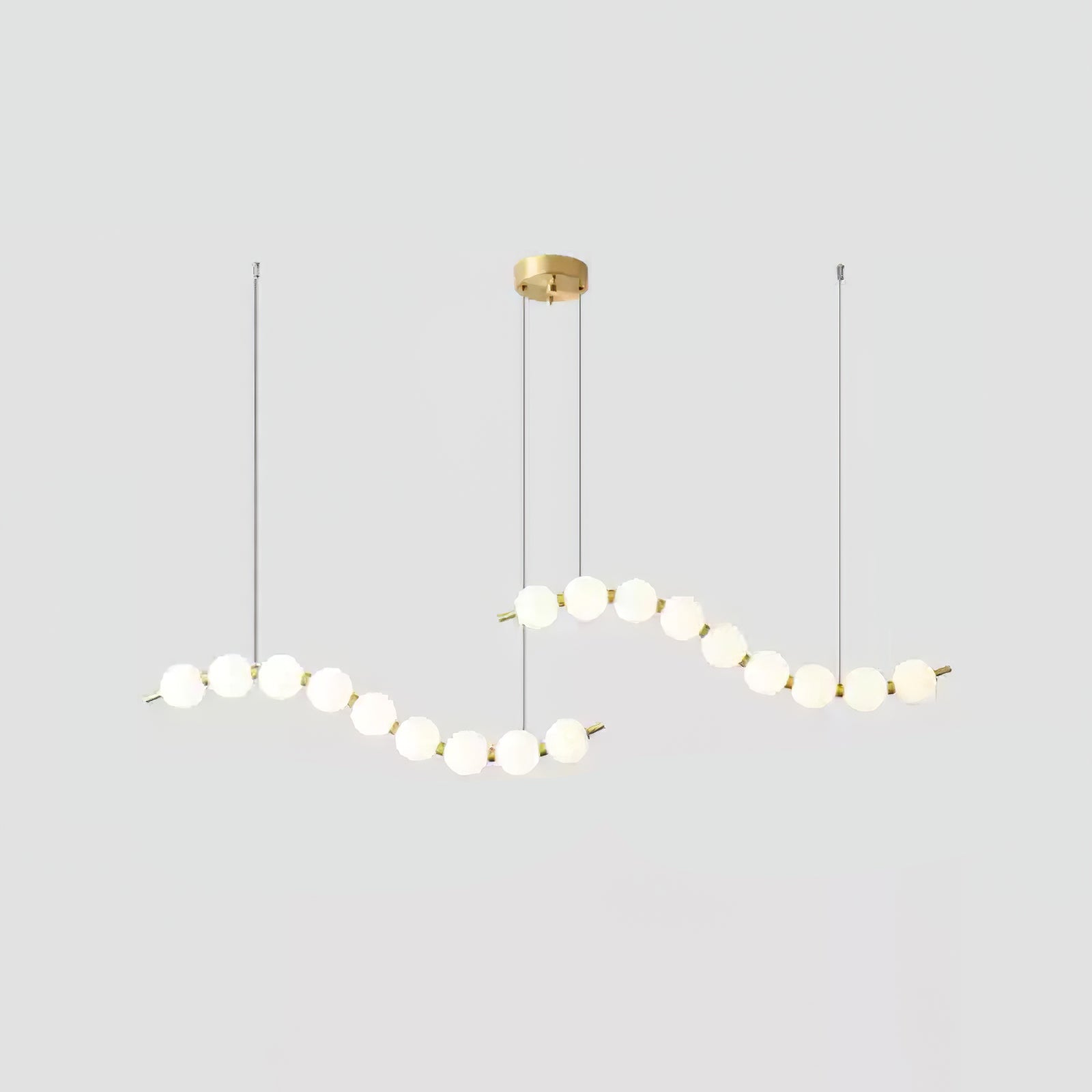 Acrylic pearl chandelier close view of orbs and brass frame