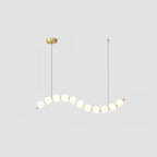 Acrylic pearl chandelier detail of white orbs and metal frame