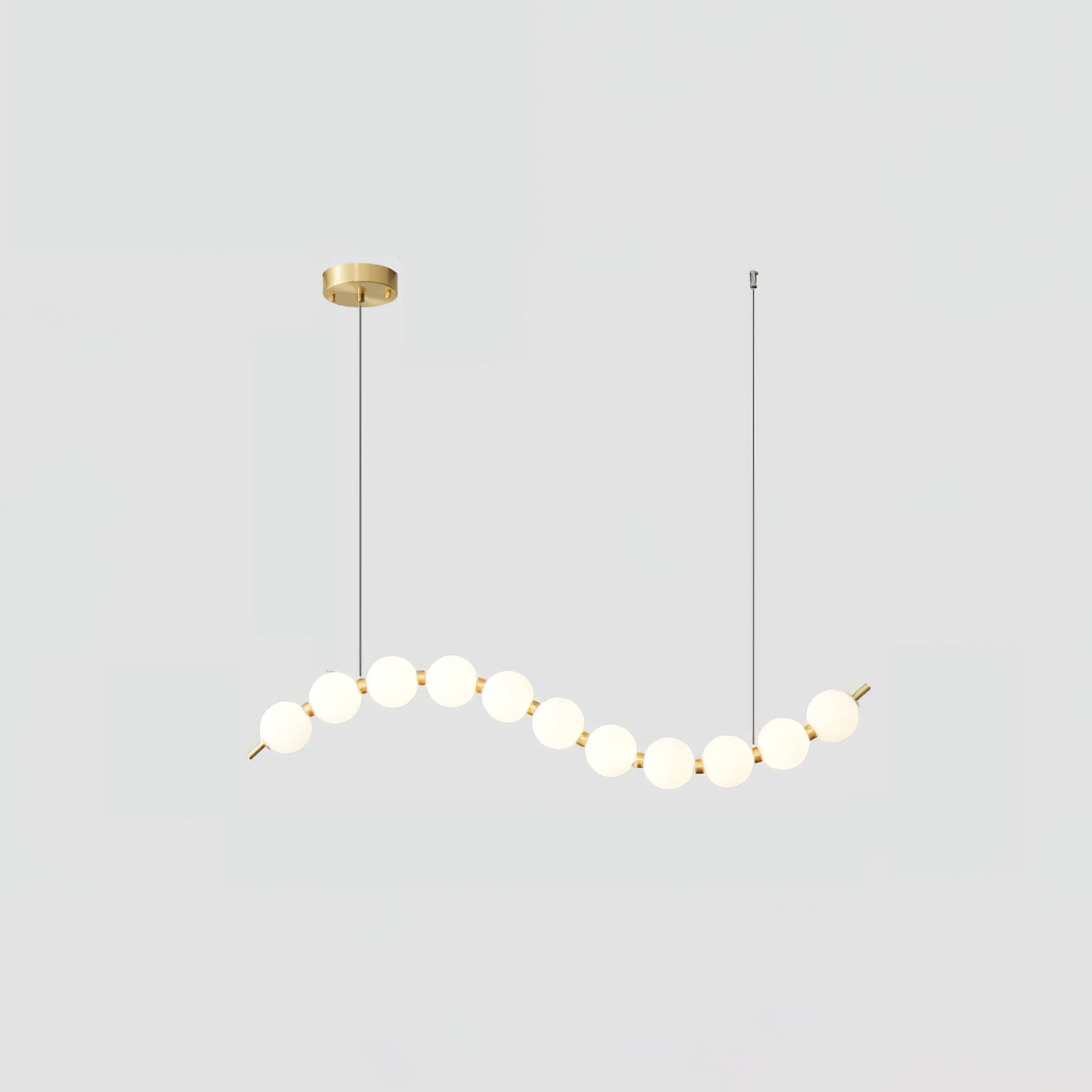 Acrylic pearl chandelier detail of white orbs and metal frame