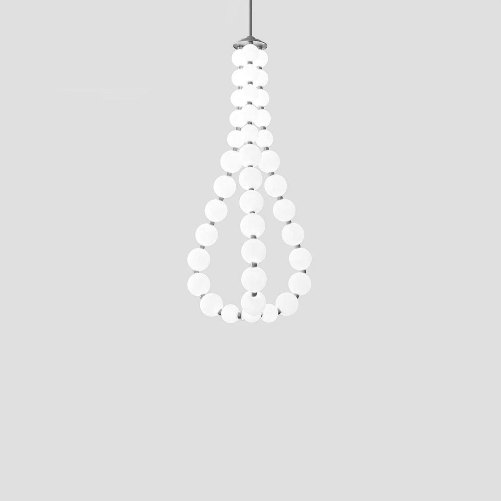 Acrylic pearl chandelier with chrome frame in a bright room