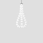 Acrylic pearl chandelier with chrome frame in a bright room