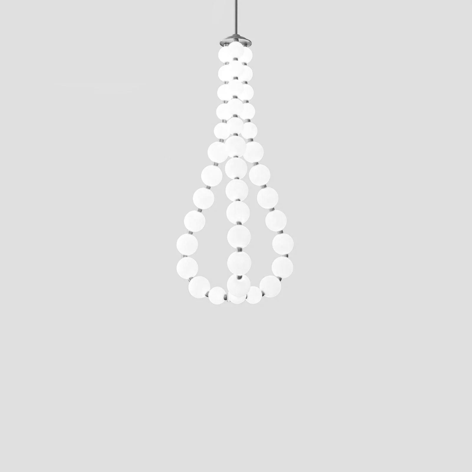 Acrylic pearl chandelier with chrome frame in a bright room