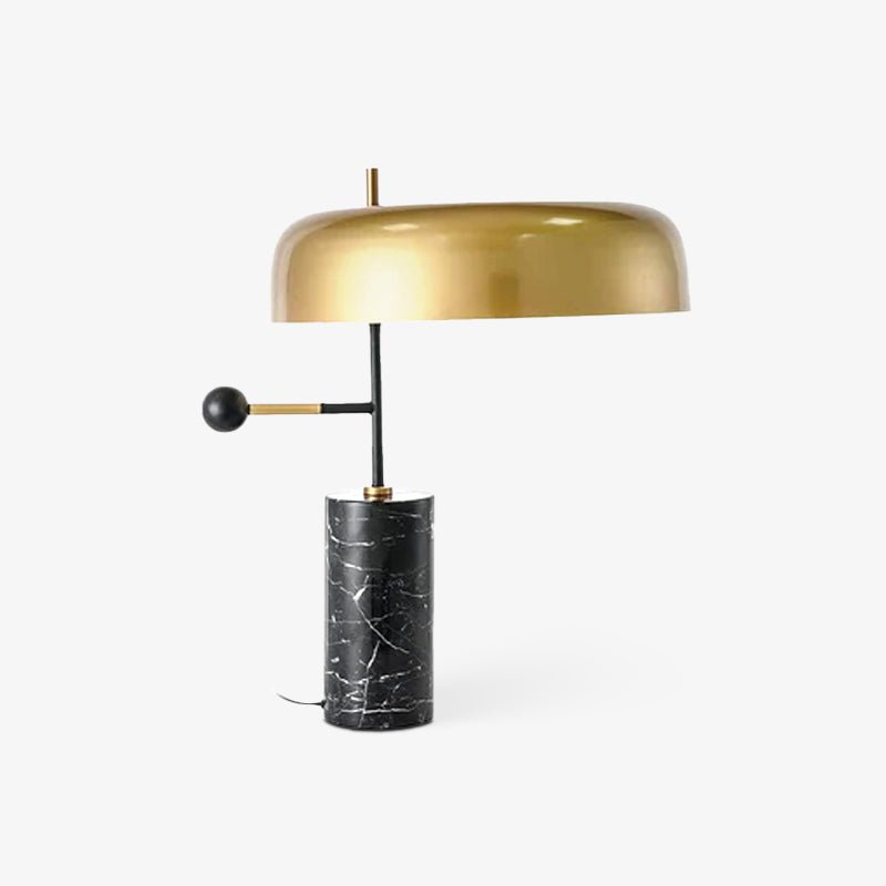 A final white-background shot of the Clérachic gold dome table lamp, its cord trailing from the marble base.