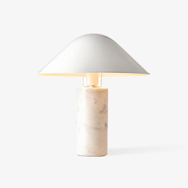Against a plain white studio backdrop, this Clérachic white marble table lamp stands alone with no surrounding props.
