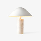 Against a plain white studio backdrop, this Clérachic white marble table lamp stands alone with no surrounding props.