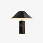 Clérachic black marble table lamp with its angled black shade photographed against a plain white studio background.