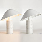 Two identical Clérachic white marble table lamps lit side by side on a white studio background, cords visible at the base.