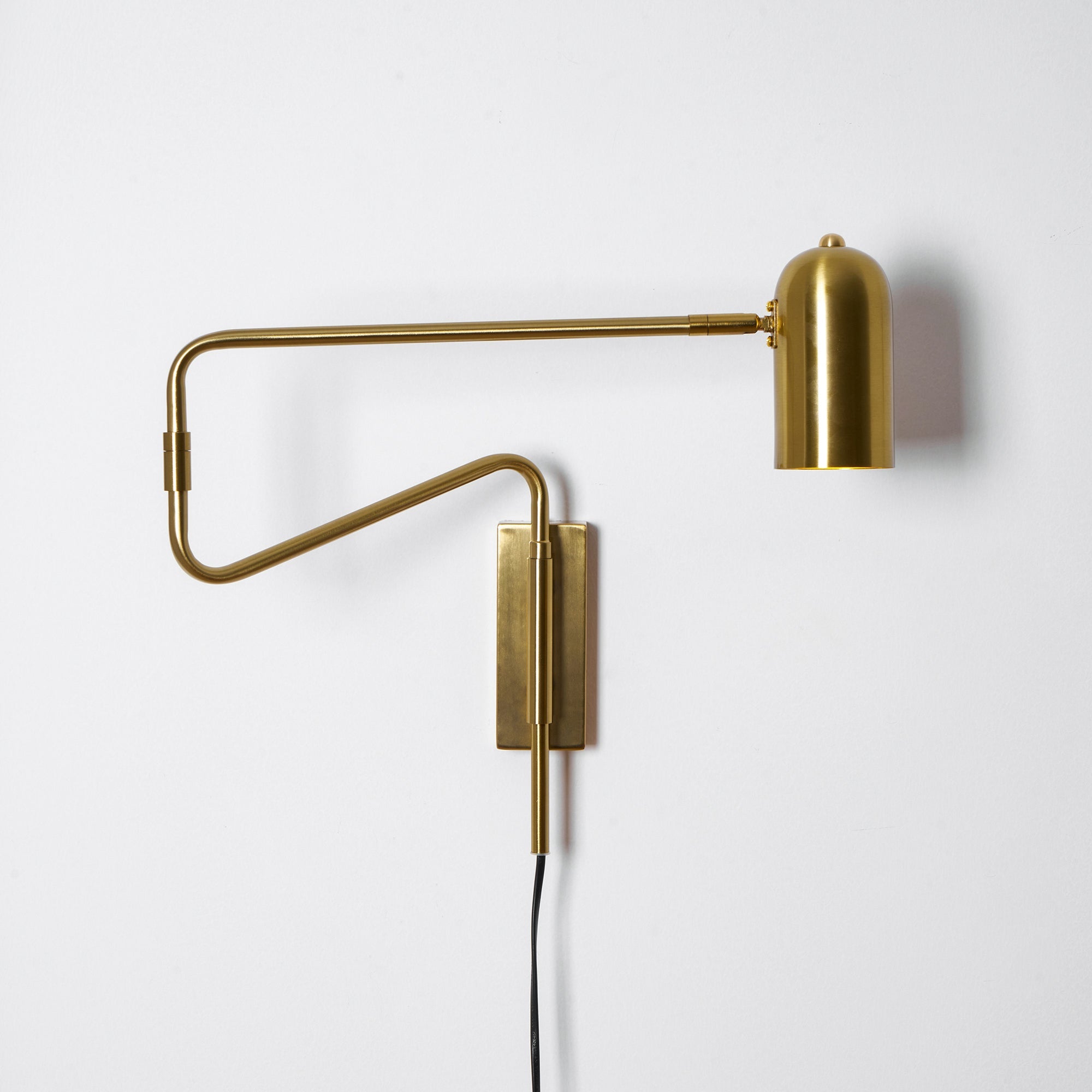 Swing arm wall lamp with the arm folded close to the wall