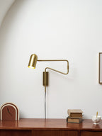 Swing arm wall lamp shown with the arm fully extended