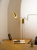 Swing arm wall lamp compact model angled downward