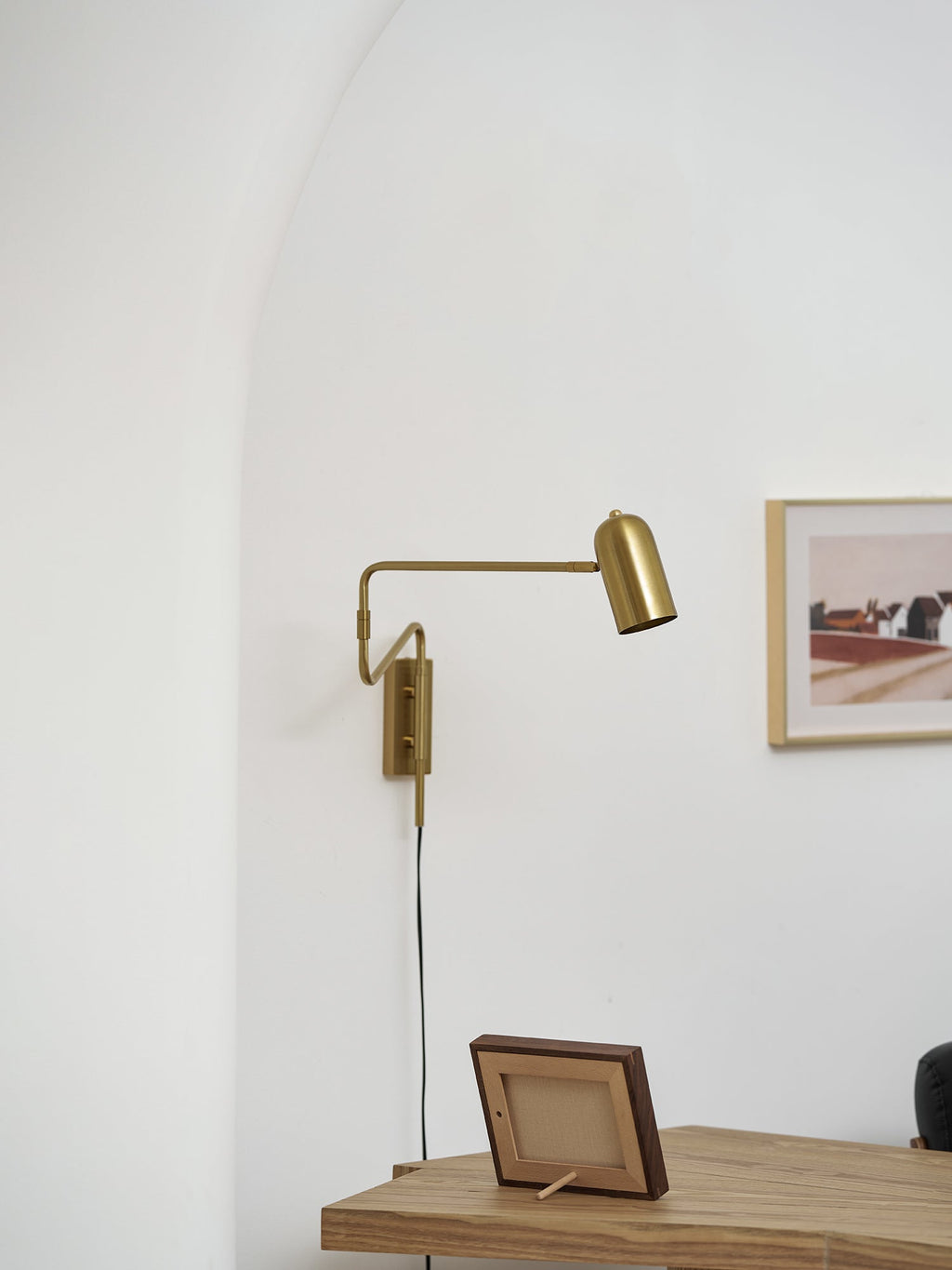 Swing arm wall lamp detail of arm hinge and shade