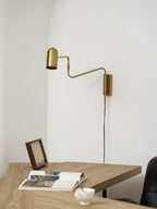 Swing arm wall lamp black finish in a styled interior