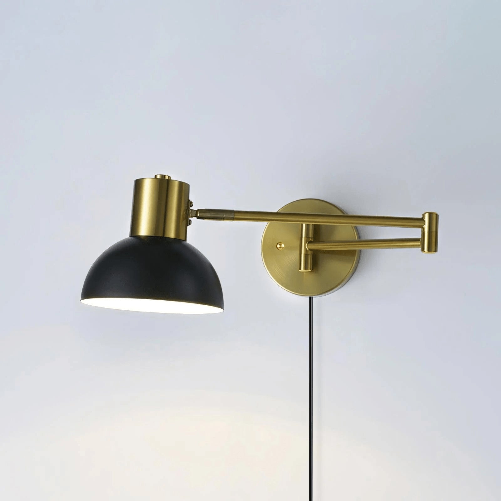 Swing arm wall lamp gold model shown from the side