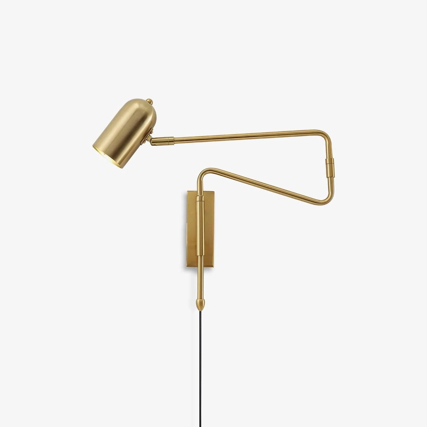 Swing arm plug-in wall lamp mounted beside a bed