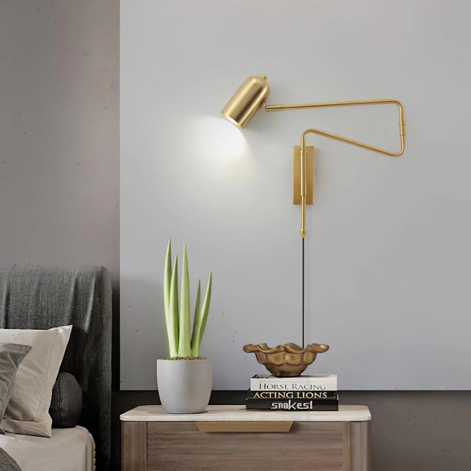 Swing arm wall lamp shown lit above a sofa