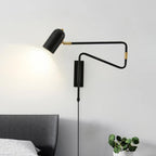 Swing arm wall lamp with the arm extended over a chair
