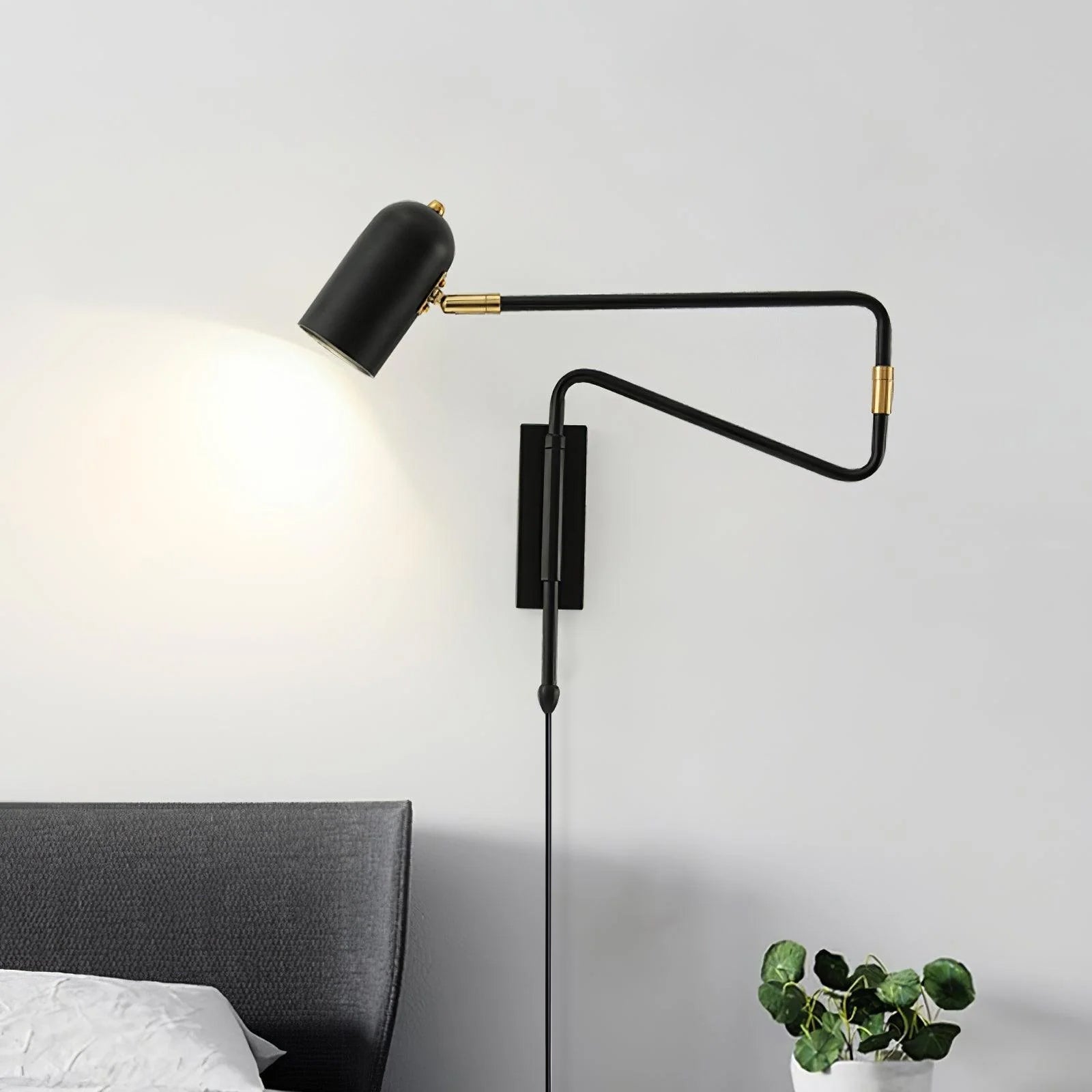Swing arm wall lamp with the arm extended over a chair