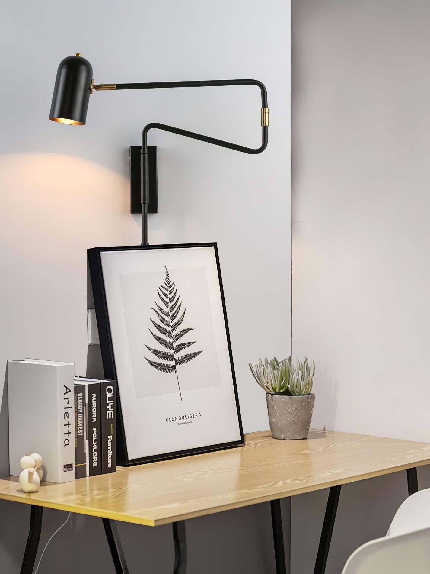 Swing arm wall lamp mounted beside a bedside table